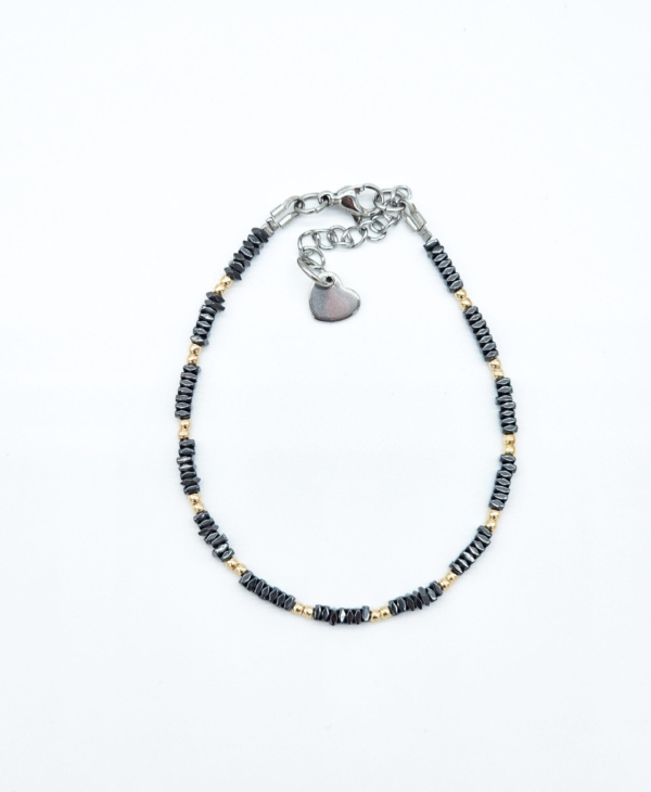 Solidi ir itin smulki rankų darbo apyrankė iš auksinės ir antracito spalvų hematito. Puiki dovana.